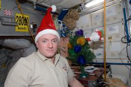 ISS-26 Scott Kelly with Santa Claus hat.jpg